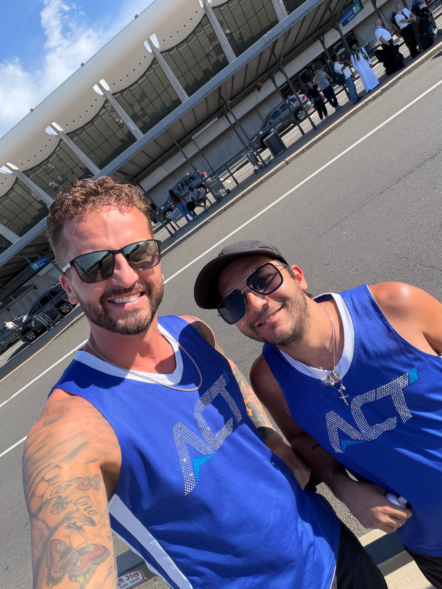 Two ACT coaches in ACT jerseys traveling to camp