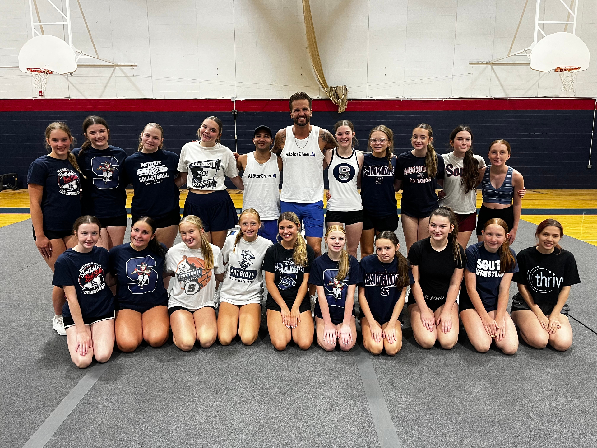 High school cheer team with ACT coaches